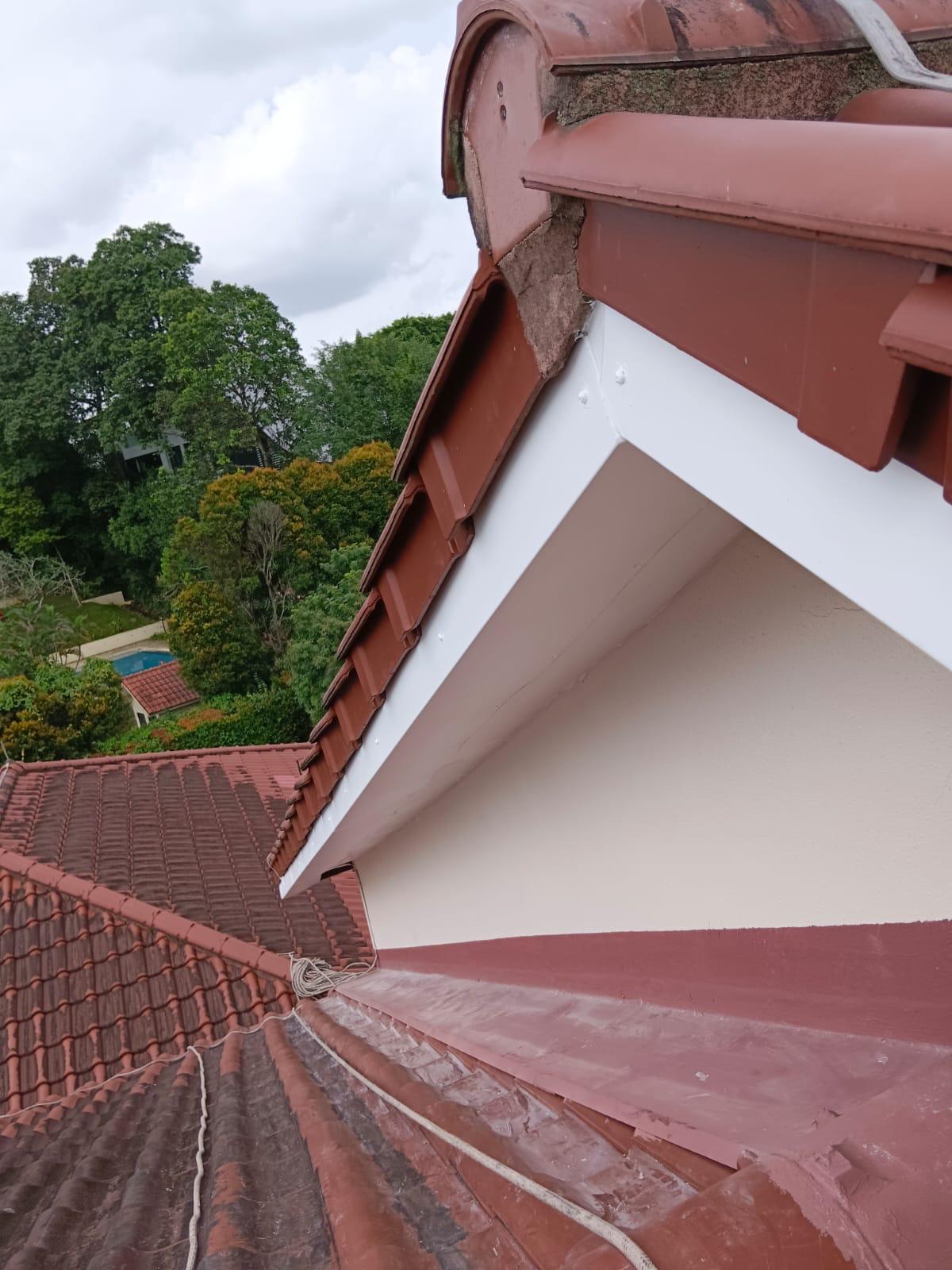 Close-up of waterproofed soffit board sealing the underside of the tiled eave at the Ewart Park bungalow second unit