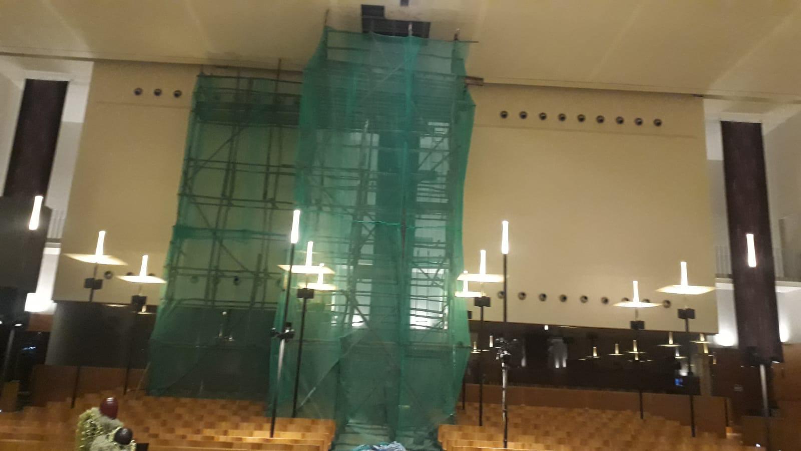 Close-up of the water-damaged ceiling board section at high level inside the St Mary of the Angels Church before replacement